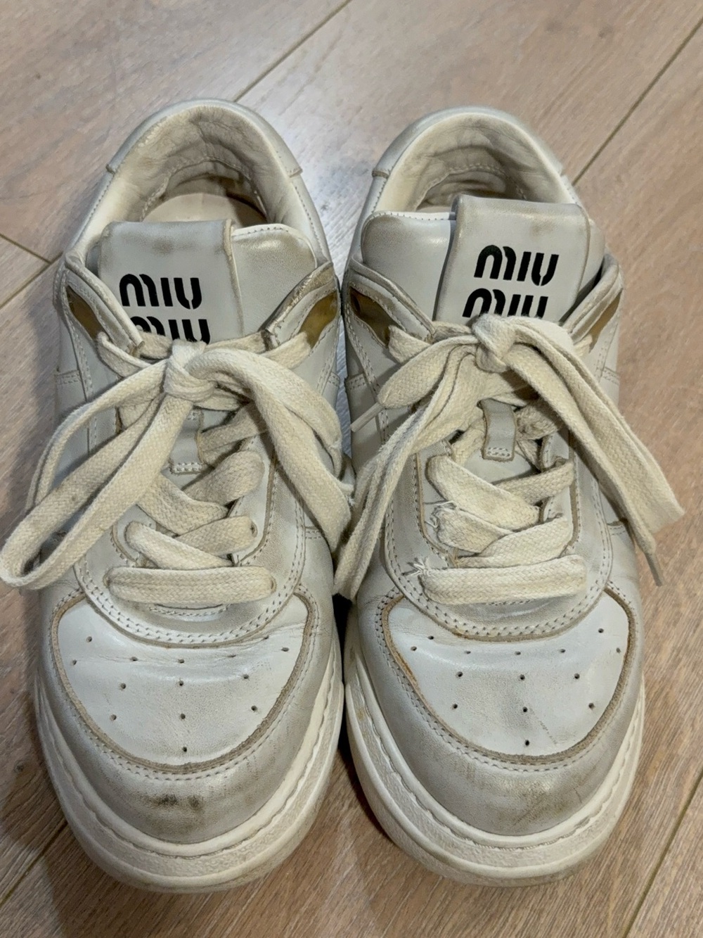 Miu Miu Off-White Leather Sneakers with Gold Trim